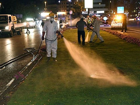Municipality workers cleaning the streets in Dubai 