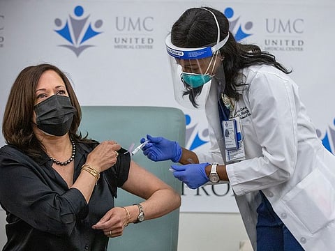 Patricia Cummings gives Vice President-elect Kamala Harris the Moderna coronavirus vaccine at the United Medical Center in Washington on Tuesday, Dec. 29, 2020. 