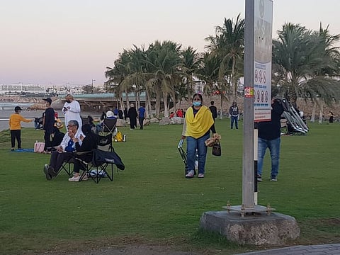 As temperatures dipped in Oman’s capital, people ventured outdoors but kept their distance from others and ensured masks were worn at all times.