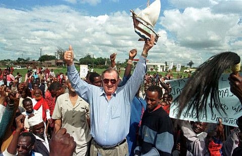 Secretary General of the "Safina" party (Ark Party) Richard Leakey holds up mini ark as he waves to a cheering crowd at Kajiado town, Kenya, December  17, 1997.