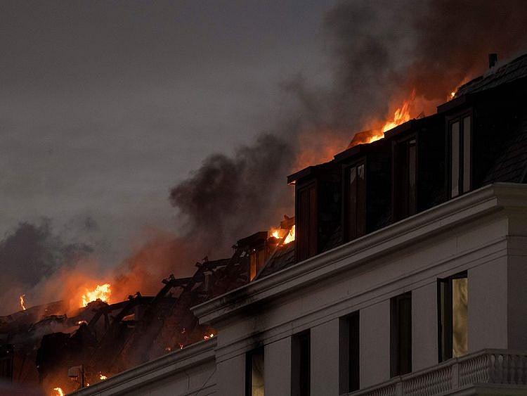 Flames arise from the National Assembly, the main chamber of the South African Parliament buildings