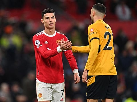 Manchester United's Cristiano Ronaldo (left) shakes hands with Wolverhampton Wanderers' Romain Saiss after losing the English Premier League match at Old Trafford on Sunday.