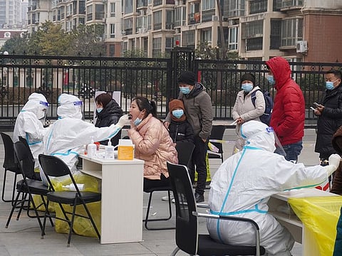 Residents line up for nucleic acid testing following  cases of COVID-19 in Zhengzhou, Henan province, China January 4, 2022.  