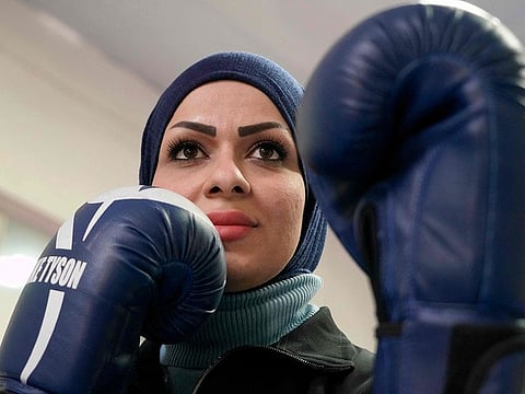 Bushra Al Hajjar, a 35-year-old Iraqi boxing instructor, is pictured during a training session at the Islamic University in Najaf. 