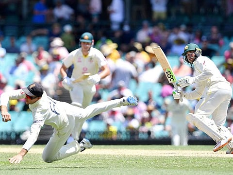 Usman Khawaja leaves England's Joe Root flailing