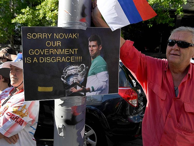 Protestors rally outside a government detention centre where Serbia's tennis champion Novak Djokovic is being held