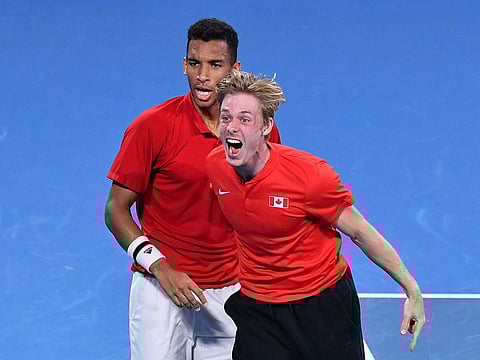 Team Canada's Felix Auger-Aliassime, left, and Denis Shapovalov celebrate their win 