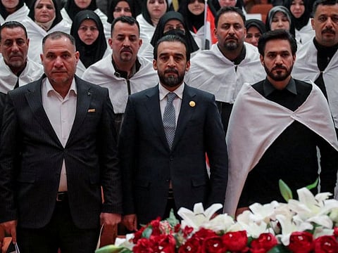 Iraq's newly elected for a second term as speaker of Parliament Mohammed Al Halbousi (centre) attends the parliament headquarters in Baghdad, January 9, 2022.