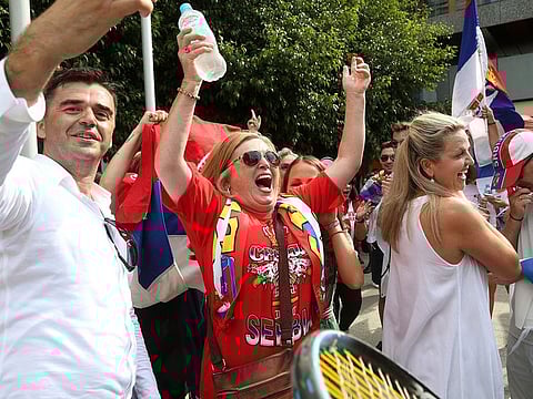 Fans of Serbia's Novak Djokovic react to news of his overturned ruling 