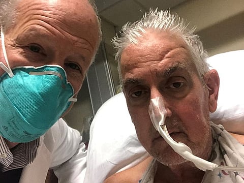 David Bennett, a 57-year-old patient with terminal heart disease, poses with surgeon Bartley P. Griffith, MD before he received a successful transplant of a genetically-modified pig heart at University of Maryland Medical Center in Baltimore, Maryland, U.S. in an undated photograph.  