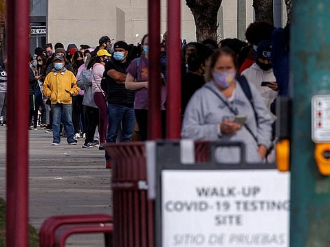 People wait outside a community center as long lines continue for individuals trying to be tested for COVID-19 during the outbreak of the coronavirus disease in San Diego, California, U.S., January 10, 2022.