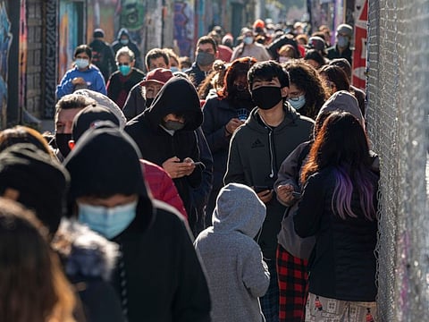 Residents wait in line for a COVID-19 test in San Francisco, California, on January 10, 2022. 