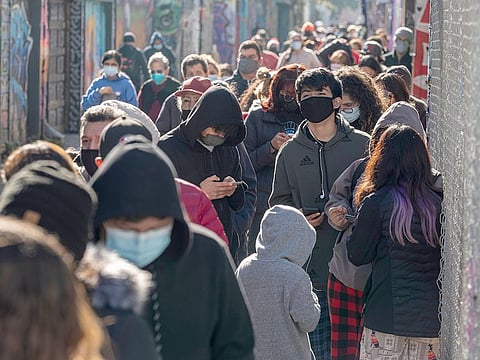 Residents wait in line for a COVID-19 test at testing site in San Francisco, California. 