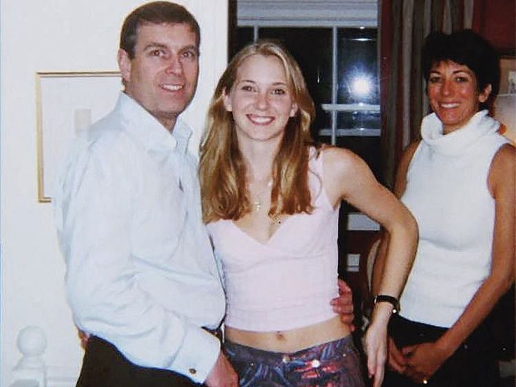 An undated handout photo taken at an undisclosed location and released on August 9, 2021 by the United States District County for the Southern District of New York shows Prince Andrew, Virginia Giuffre, and Ghislaine Maxwell posing for a photo.  