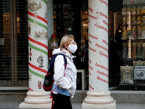 A woman walks in downtown Budapest in a file photo.