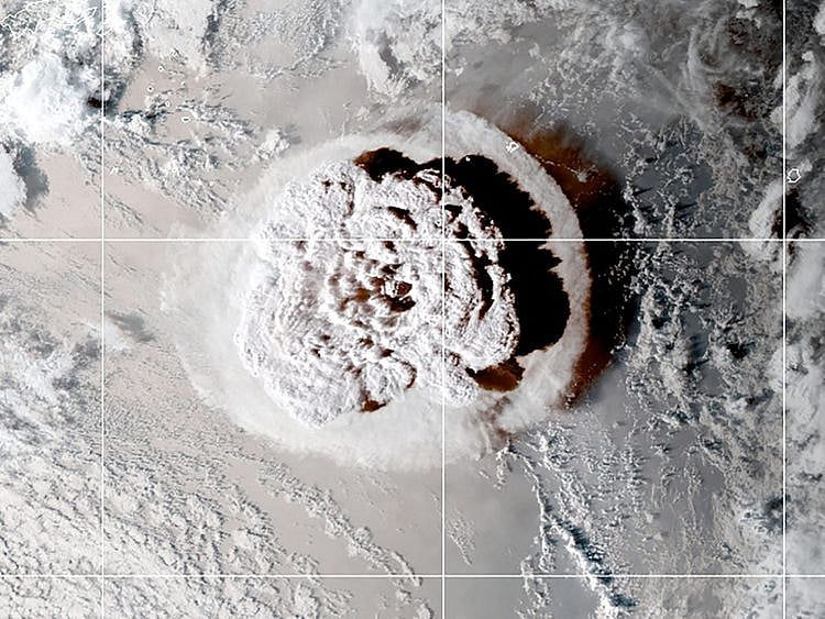 The eruption of an underwater volcano off Tonga, which triggered a tsunami warning for several South Pacific island nations, is seen in an image from the NOAA GOES-West satellite taken at 05:00 GMT January 15, 2022.