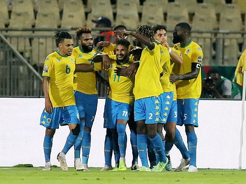 Gabon's Jim Allevinah celebrates scoring the equalising goal with teammates.