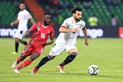 Egypt's forward Mohamed Salah (right) runs with the ball during the Group D Africa Cup of Nations match against Guinea-Bissau at Stade Roumde Adjia in Garoua.