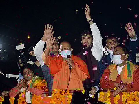 Uttar Pradesh Chief Minister Yogi Adityanath waving to the supporters 