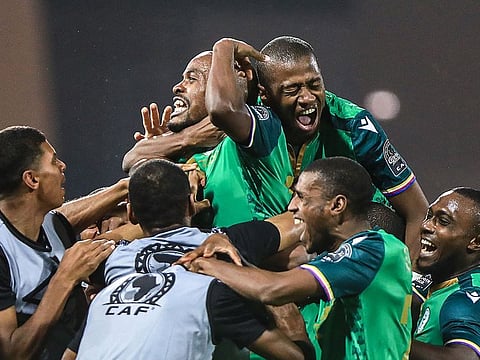 Comoros’ forward Ahmed Mogni (C) celebrates with teammates after scoring his team’s second goal against Ghana.