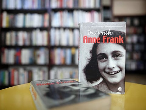 In this file photo taken on December 4, 2018, copies of 'The Diary of Anne Frank' are seen on a table in a public library in Zagreb.