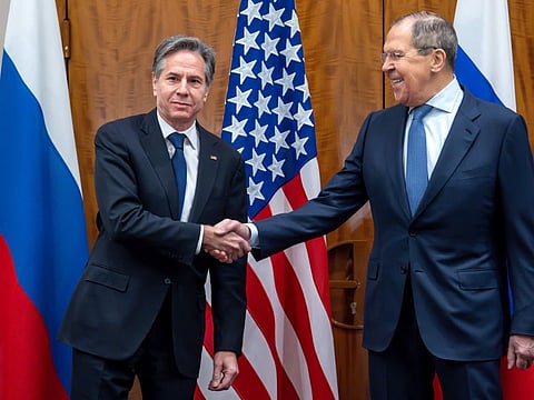 U.S. Secretary of State Antony Blinken, left, shake hands with Russian Foreign Minister Sergei Lavrov, right, prior to their meeting in Geneva, Switzerland, Friday, Jan. 21, 2022.