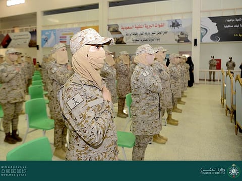 Women cadets attend the graduation ceremony. 