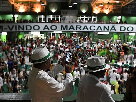A member of the Mocidade samba school takes a picture during a rehearsal amid the outbreak of the coronavirus disease (COVID-19), before the carnival parade in Rio de Janeiro, Brazil, January 16, 2022.