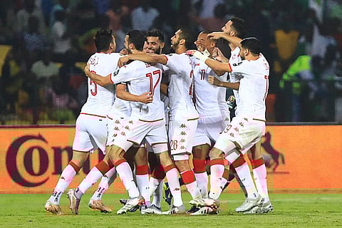 Tunisia's players celebrate after scoring against Nigeria in the Africa Cup of Nations round of 16 match at Stade Roumde Adjia in Garoua.