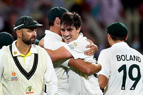 Australian captain Pat Cummins (second from right) celebrates with teammates after defeating England on the third day of the fifth and final Ashes Test in Hobart. Nathan Lyon (left) feels bigger challenge awaits the triumphant Australians.