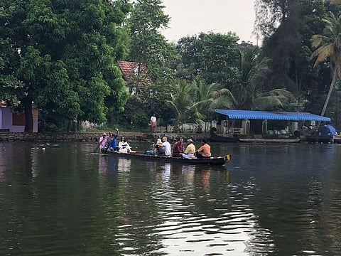Tourists and locals enjoy a row boat ride at the Punnamada Lake.