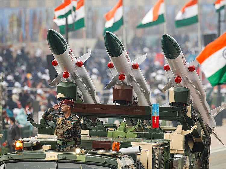 An Indian soldier salutes while standing in a vehicle during the Republic Day parade in New Delhi, on January 26, 2022. 