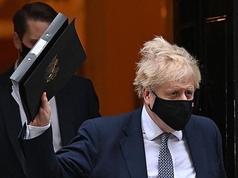 Britain's Prime Minister Boris Johnson leaves from 10 Downing Street in London on January 25, 2022. 