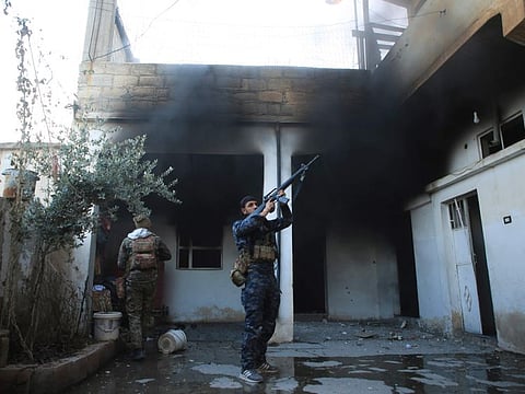 Soldier swith the US-backed Syrian Democratic Forces check a house in Hasakeh, Syria on January 25 for Daesh members. 