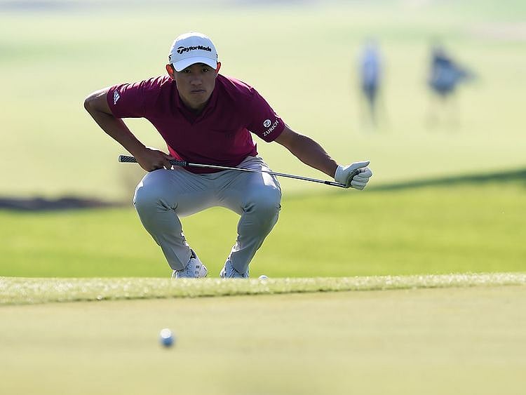 Collin Morikawa in action at the Dubai Desert Classic