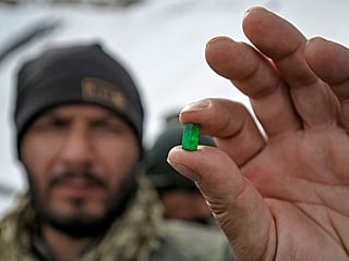 Ex-government workers mine for salvation in Afghan mountains