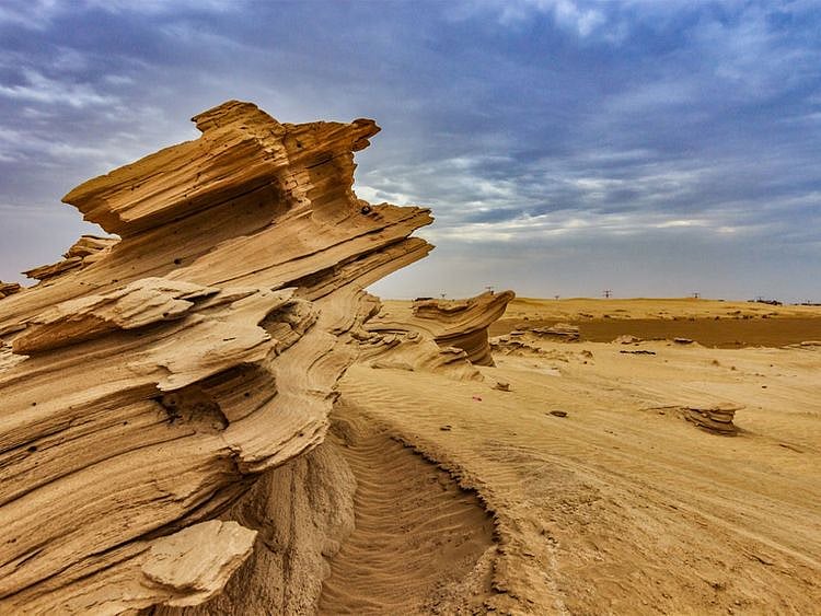Al Wathba's twisting golden sand dunes 