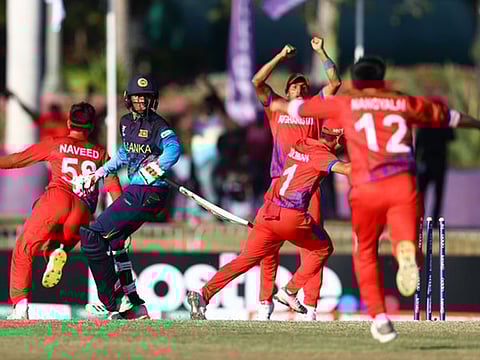 Afghanistan Under-19 boys (red) are ecstatic at the fall of the last Sri Lankan wicket, ensuring their entry in the semi-finals.