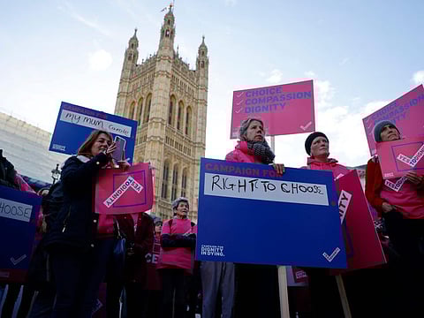 'Dignity in Dying' supporters gather to call for a change in the law to support assisted dying outside the Houses of Parliament in central London in a file photo. 