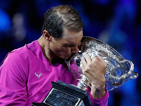 Slam no.21: Rafael Nadal celebrates winning the Australian Open final in Melbourne.