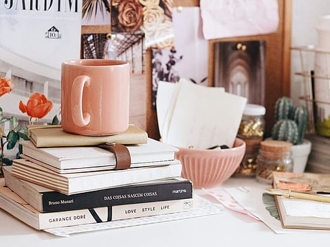 A little twine, paint, glue gun and old bottles can go a long way in cheering up your desk in no time!