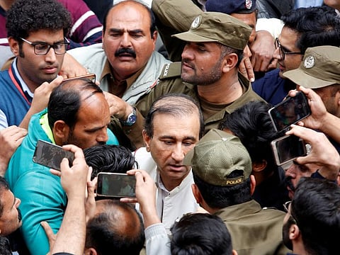 Police officers and media persons gather as Mir Shakil-ur-Rehman, owner and editor-in-chief of Jang media group, leaves after attending court proceedings in Lahore, Pakistan March 13, 2020.