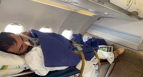 Muhammad Rashid on board the flight home.