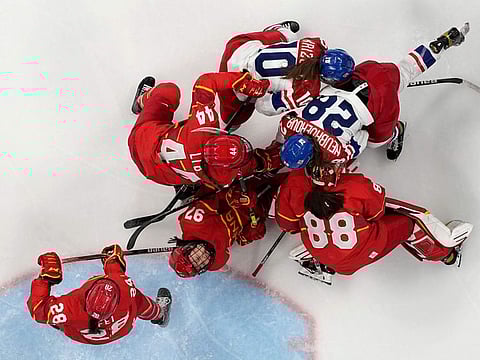 Players scrum in front of the goal during a preliminary round women's hockey game between China and debutants Czech Republic at the 2022 Winter Olympics in Beijing on Thursday.