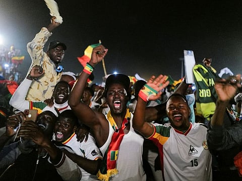 Senegal’s fans celebrate after winning the Africa Cup of Nations 2021 final against Egypt in Dakar, Senegal.