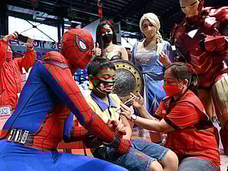 Photos: With superheroes and puppets, Philippines boosts child vaccination drive 