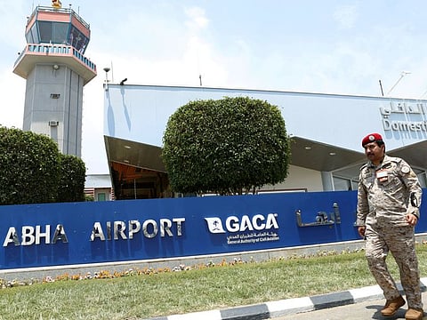 A Saudi security officer walks past Saudi Arabia's Abha airport.