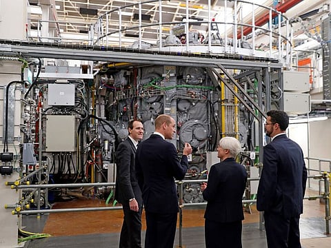 Britain’s Prince William (second left), Duke of Cambridge, during a visit to the UK Atomic Energy Authority at the Culham Science Centre in Abingdon, southern England, on October 18, 2018. Researchers at the Joint European Torus experiment near Oxford managed to produce a record amount of heat energy over a five-second period, the UKAEA announced on February 9, 2022. 