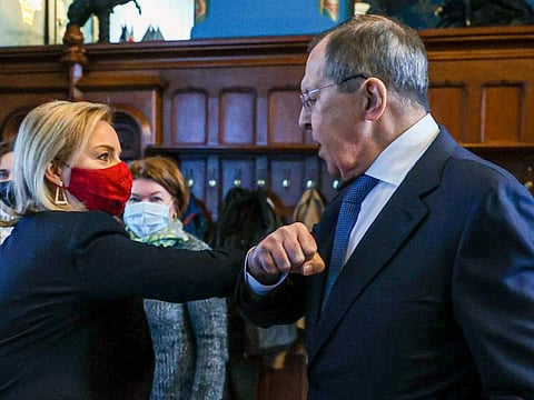 Russian Foreign Minister Sergey Lavrov, right, and British Foreign Secretary Liz Truss greet each other prior to their talks in Moscow, Russia, Thursday, Feb. 10, 2022.