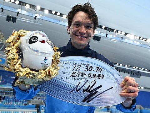 Gold medallist Sweden's Nils Van Der Poel celebrates during the venue ceremony for the men's speed skating 10,000m event at the Beijing 2022 Winter Olympic Games on Friday.